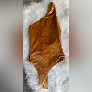 Fabletics body suite. Super comfy, yet never worn! Size XS